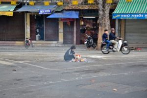 Burning money in the streets of Hanoi Vietnam